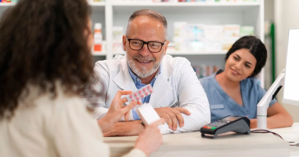Pharmacist discussing medication options with patient
